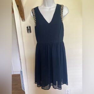 Elegant Navy Blue Sleeveless Dress with Embellished Shoulders